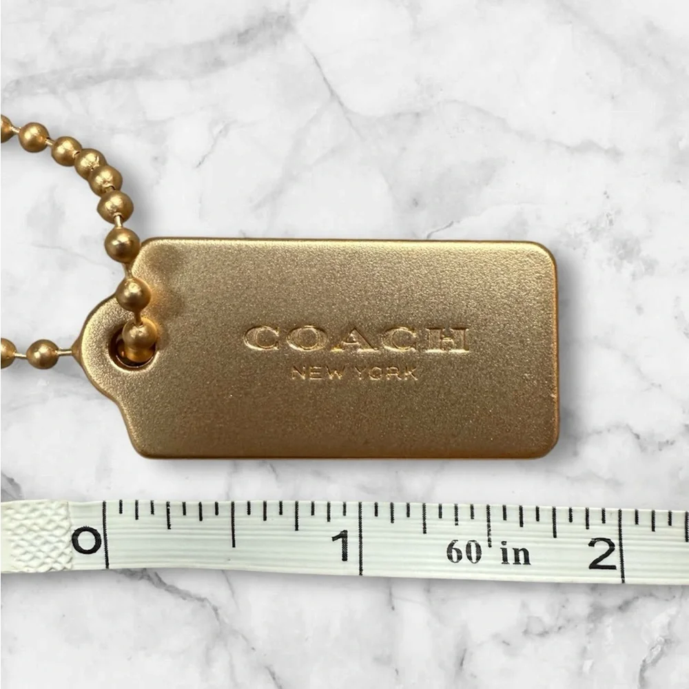 COACH Gold Tag Keychain - COACH New York Signature
